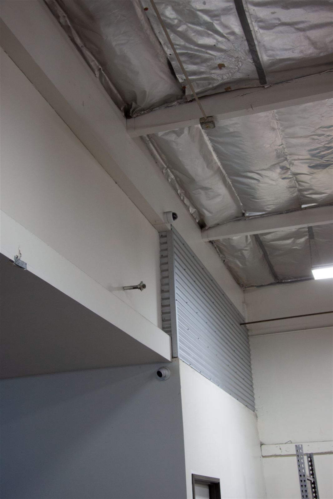 Security camera installed in a warehouse showroom